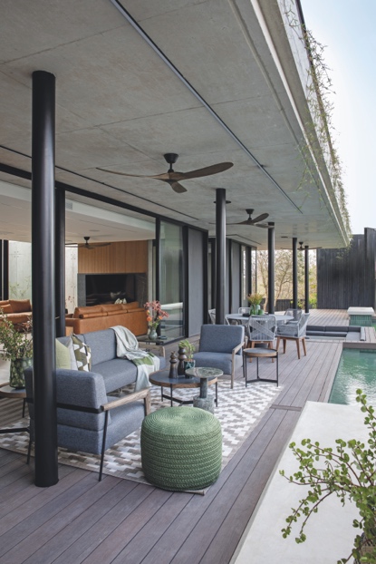 Covered poolside patio with timber ceiling fans and indoor-outdoor living